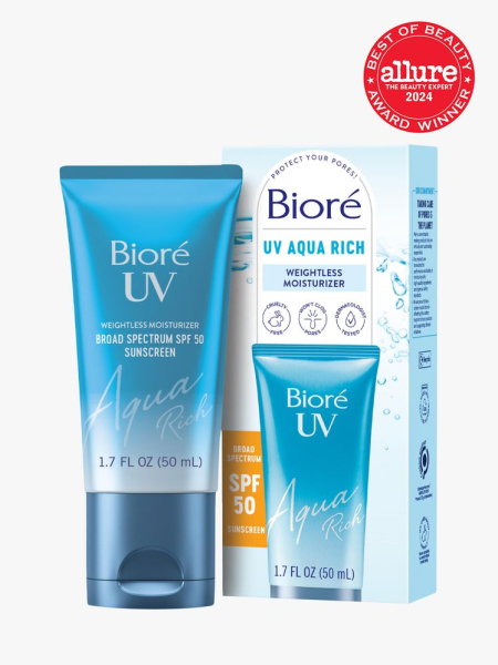 sunscreen in branded blue tube next to branded box packaging on light gray background with red and white 2024 allure best of beauty seal